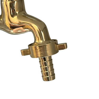 Gold faucet on a white background