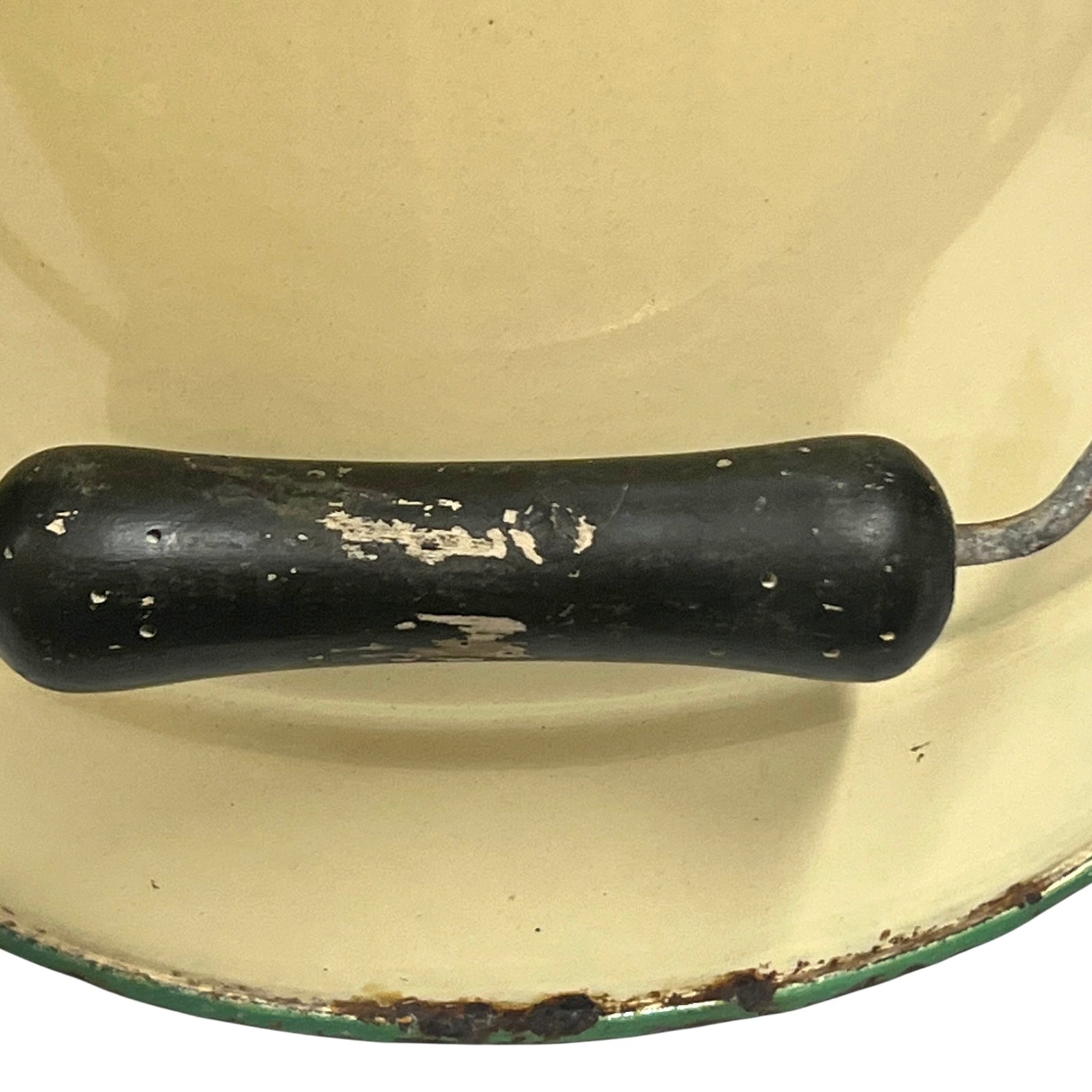 Close up of a French enamel bucket on a white background 