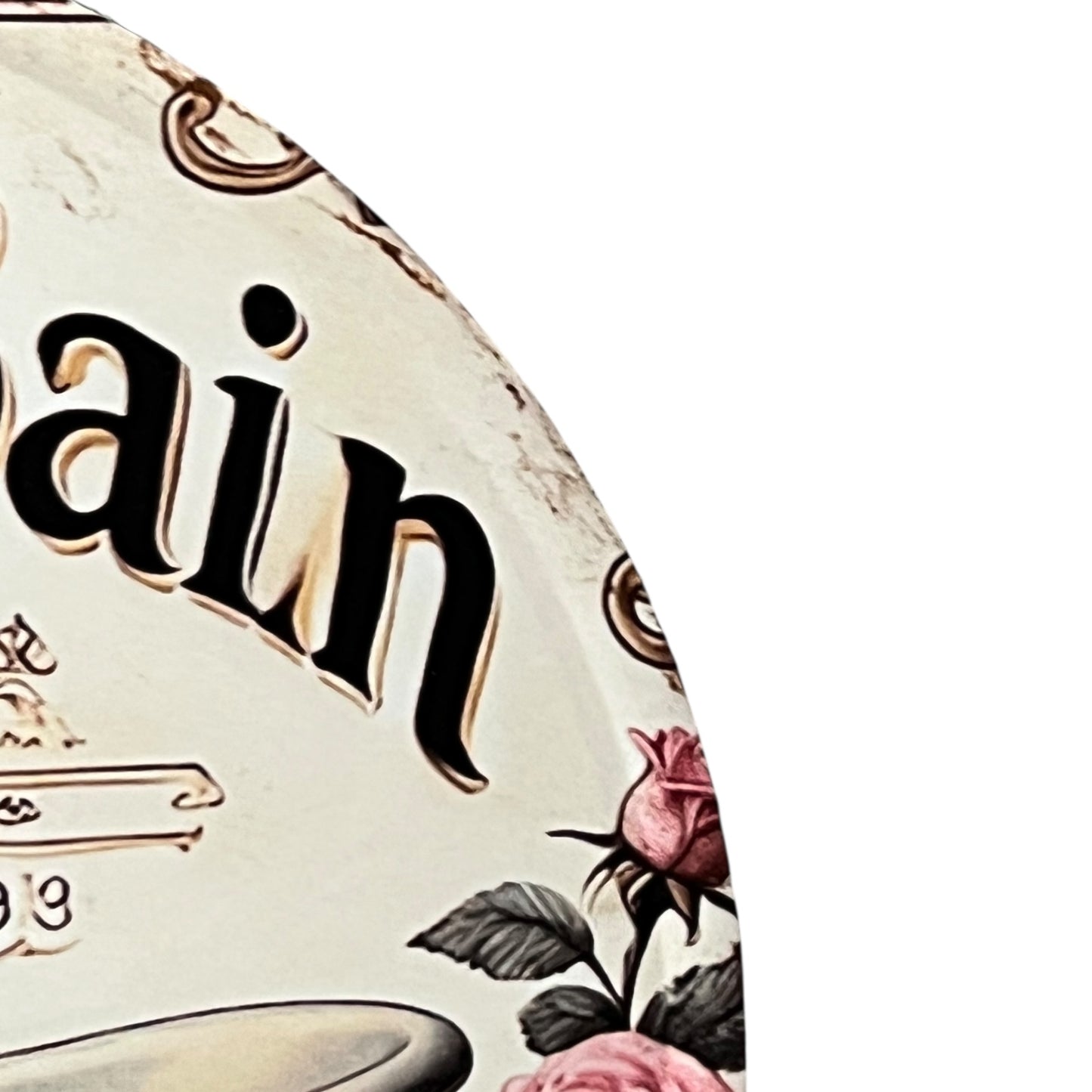 Decorative item with floral design and 'ain' text on a white background