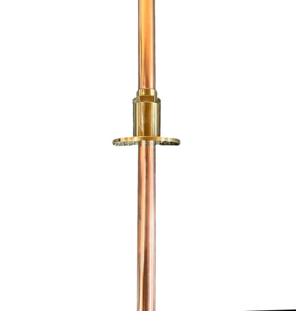Copper pipe with brass fitting on a white background