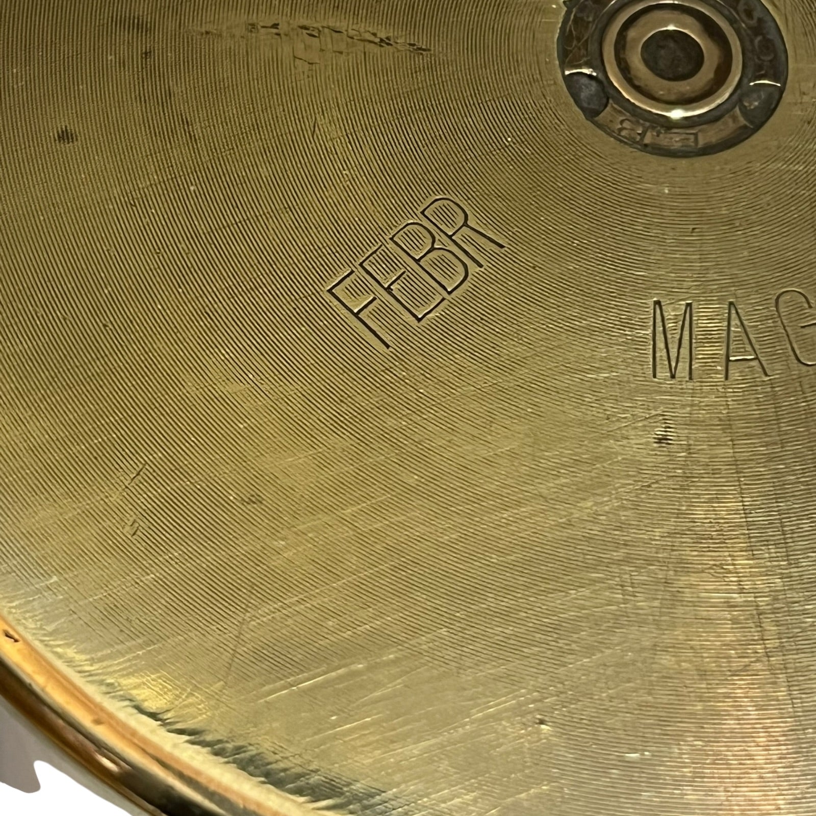 Close up of a brass WW1 German shell case on a white background