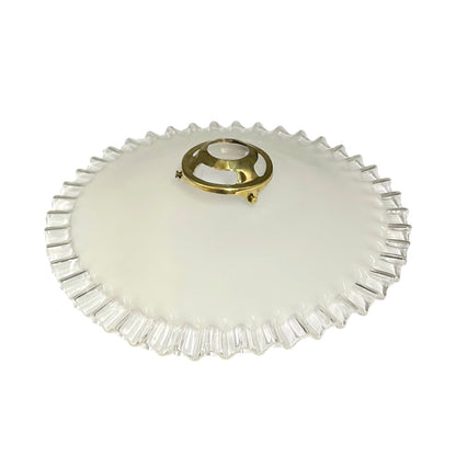 A vintage oval glass ceiling light fixture with a fluted, scalloped edge and a central gold brass mounting ring, shown on a plain white background.