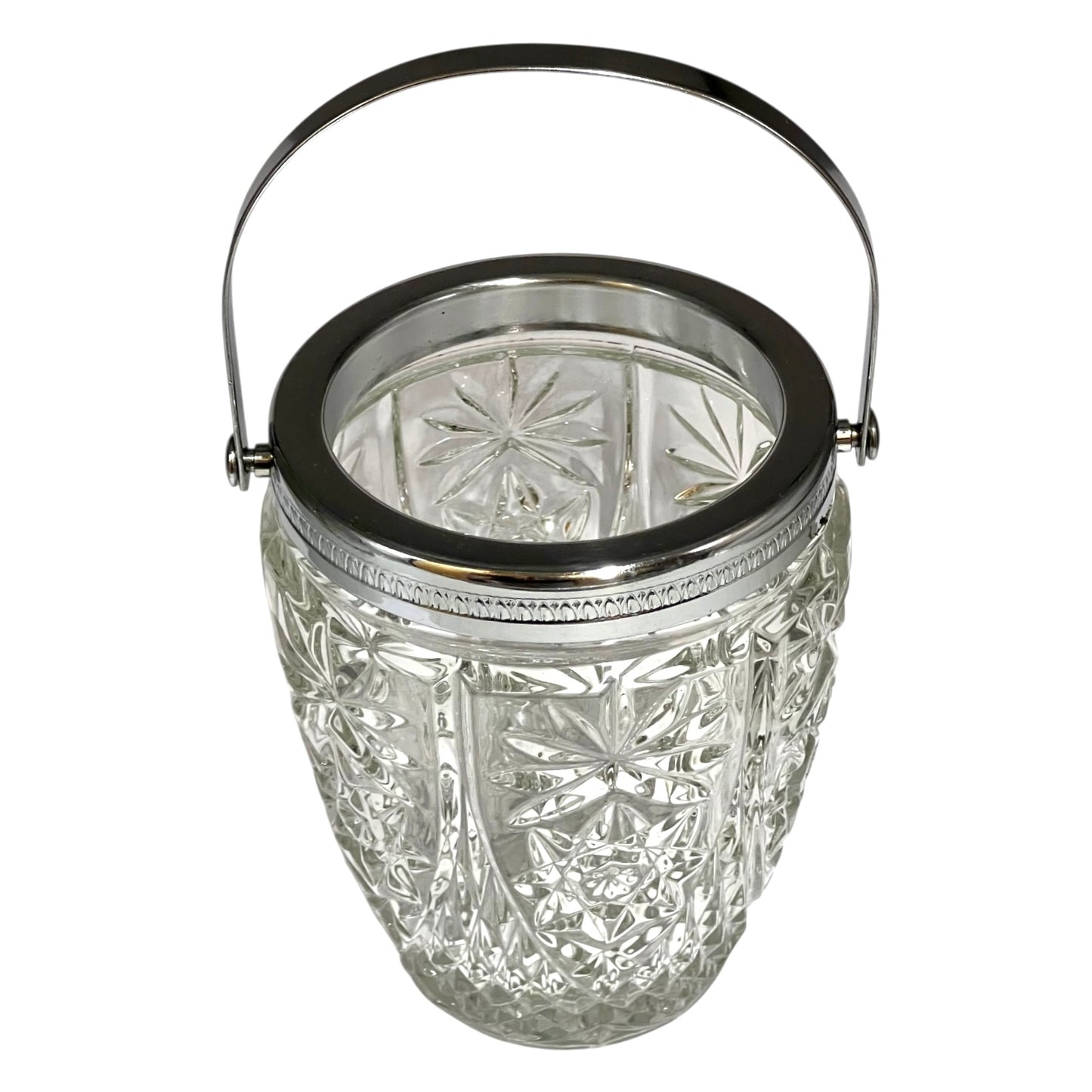 Decorative glass vintage ice bucket with metal collar and handle on a white background