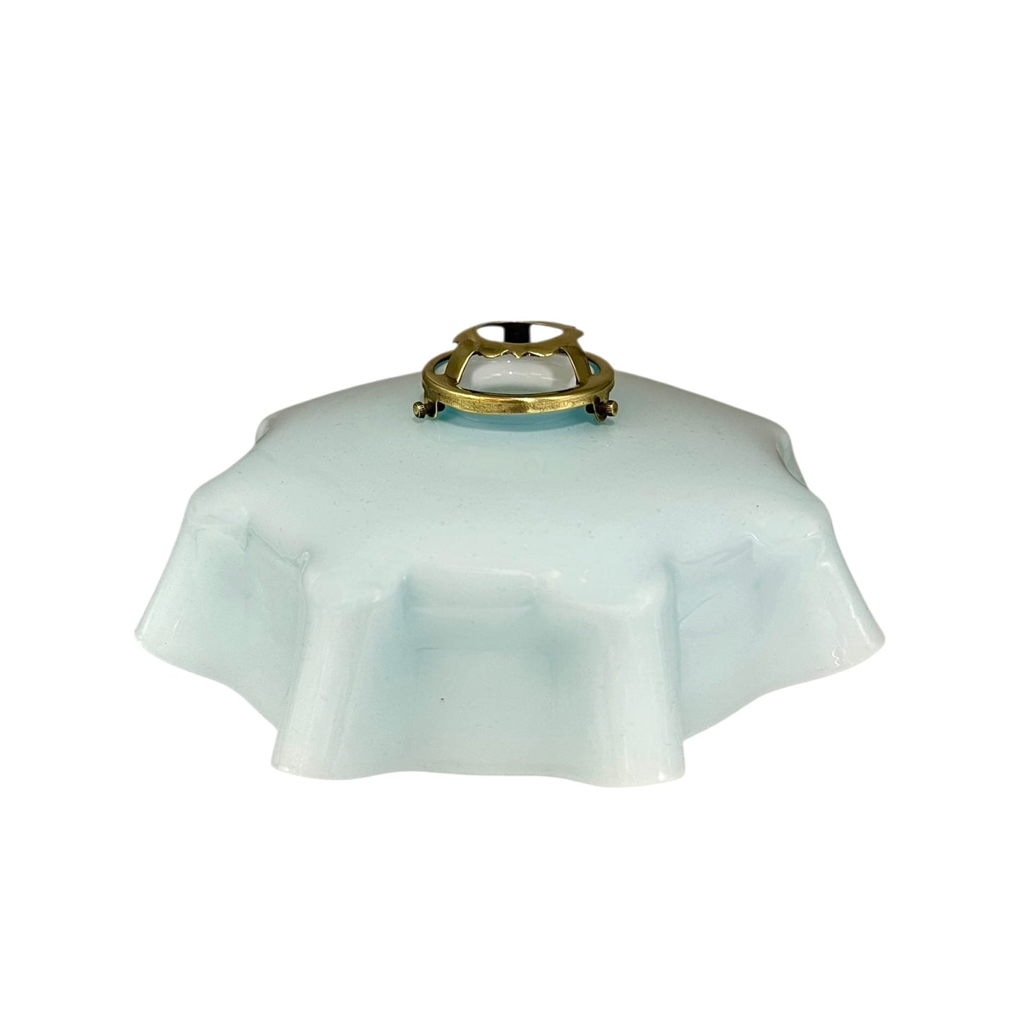 Vintage blue glass lamp shade with brass fitting on a white background