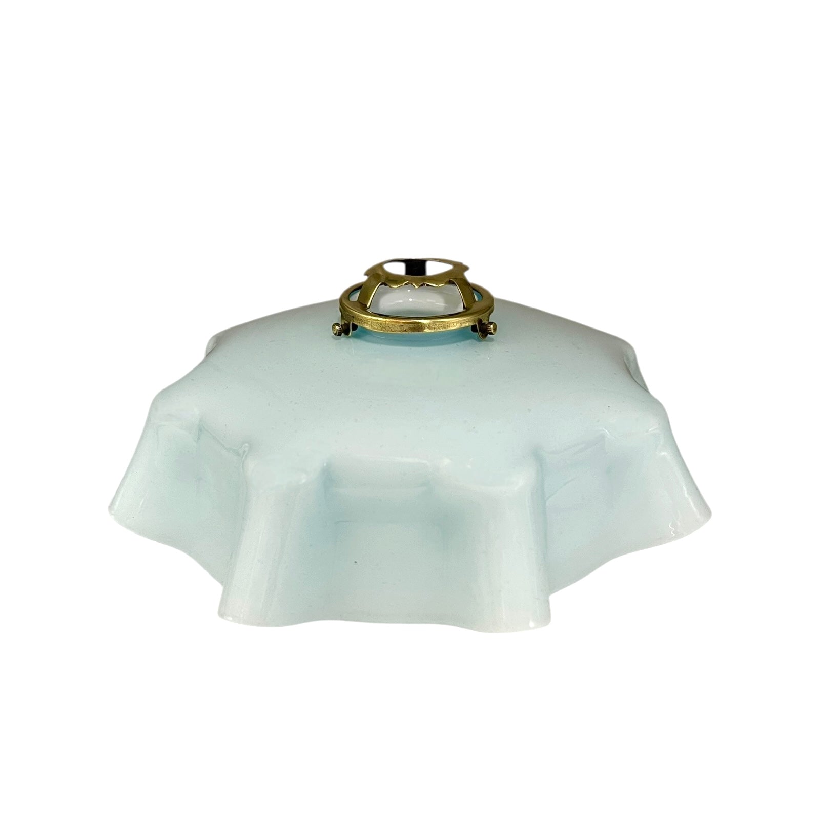 Vintage blue glass lamp shade with brass fitting on a white background