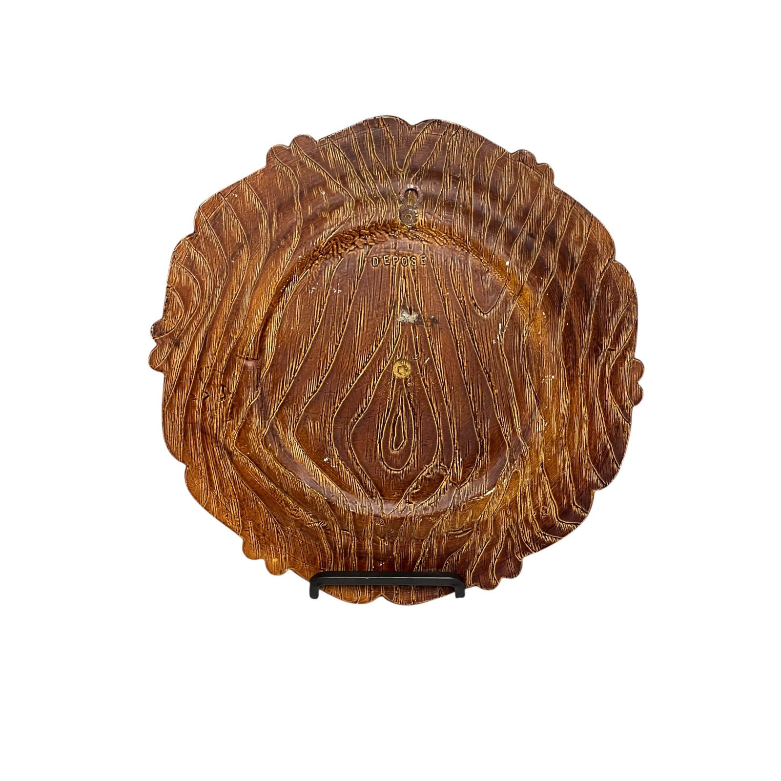 Close up of a raised 3d wood resin wall plaque of a French baker on a white background