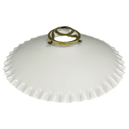 White lampshade with a gold metal fixture on a white background