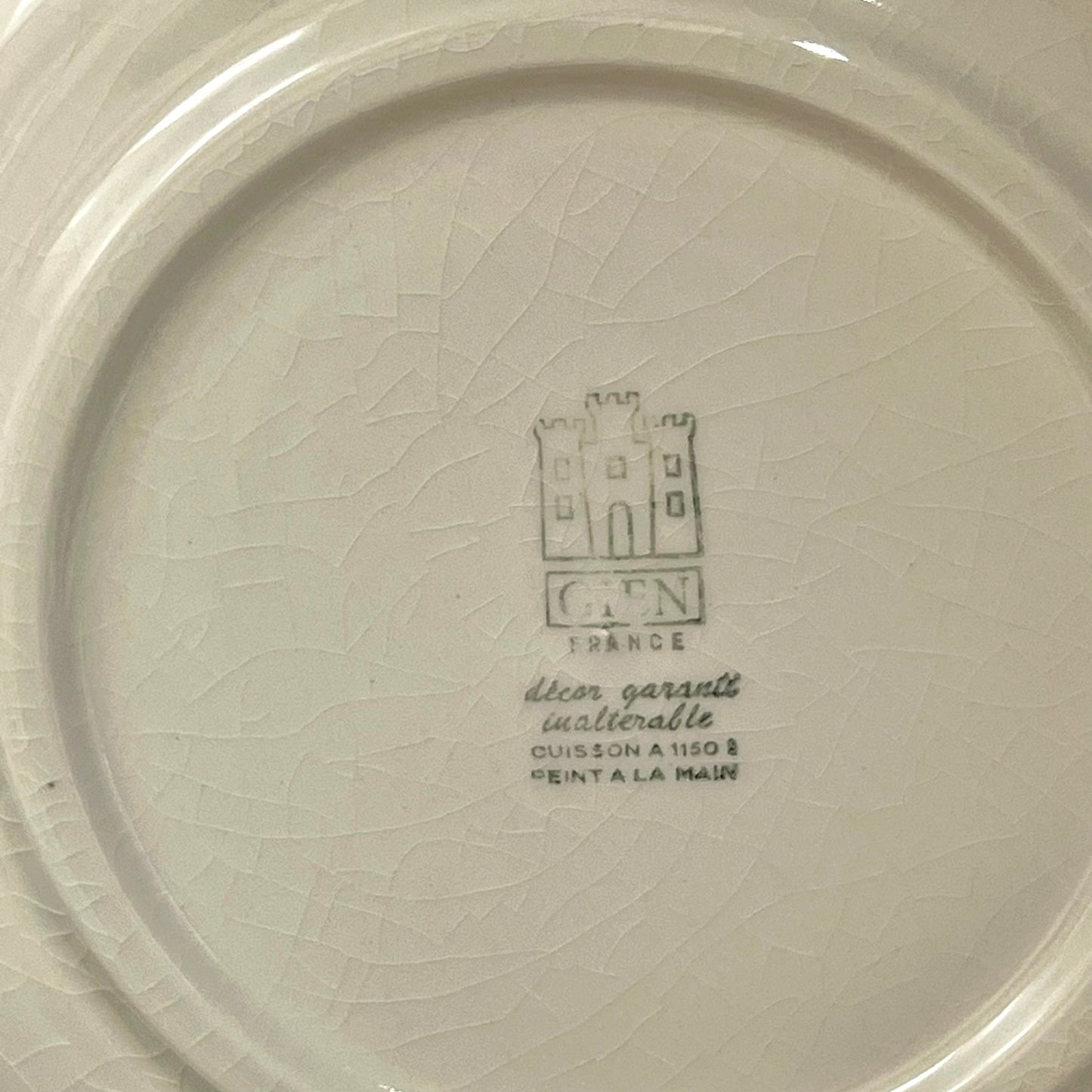 Ceramic plate with a brand logo and text on a white background