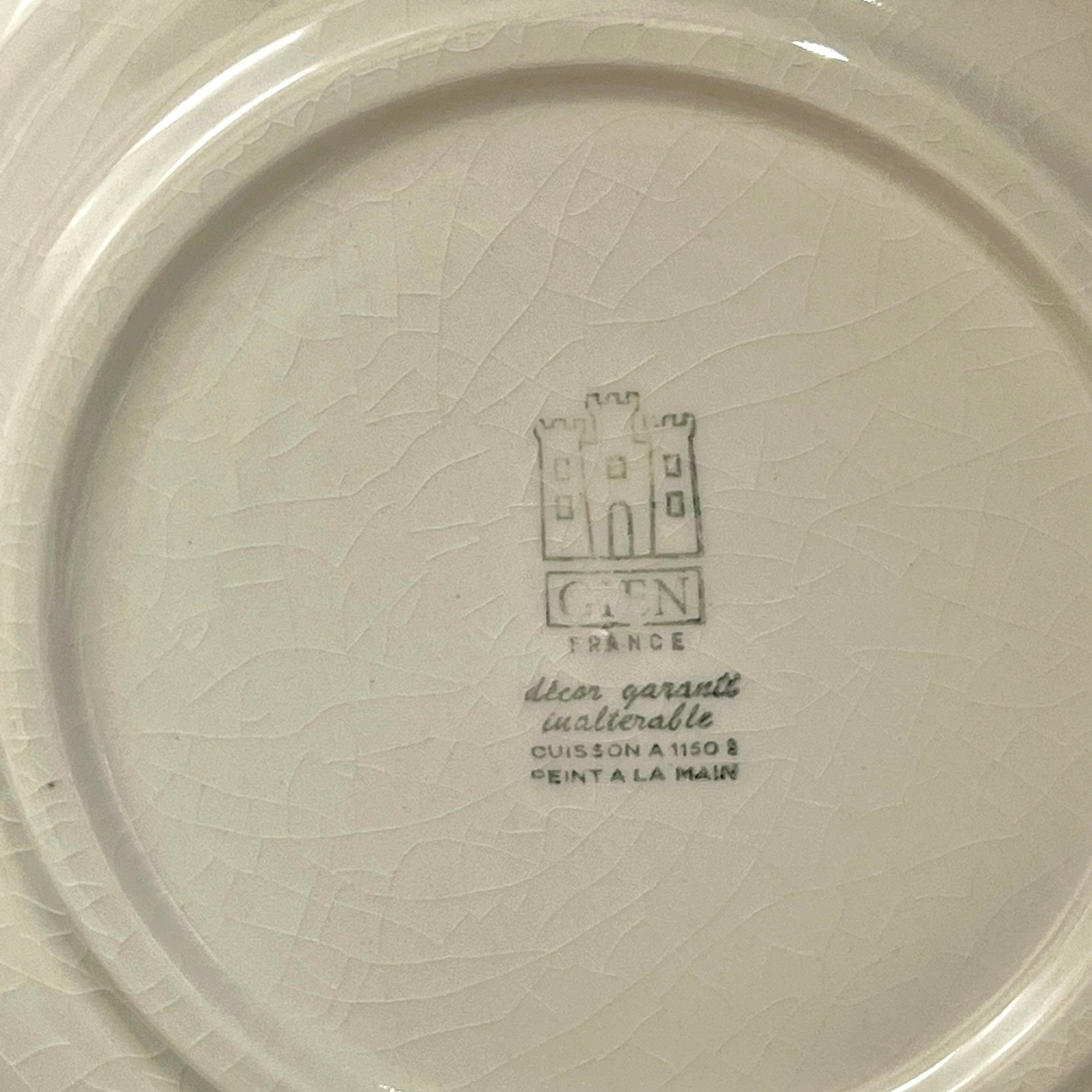 Ceramic plate with a brand logo and text on a white background