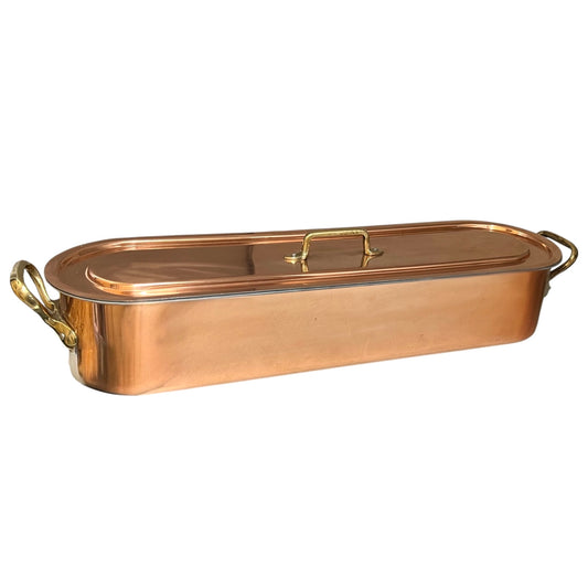 Copper French fish poaching pan with lid on a white background