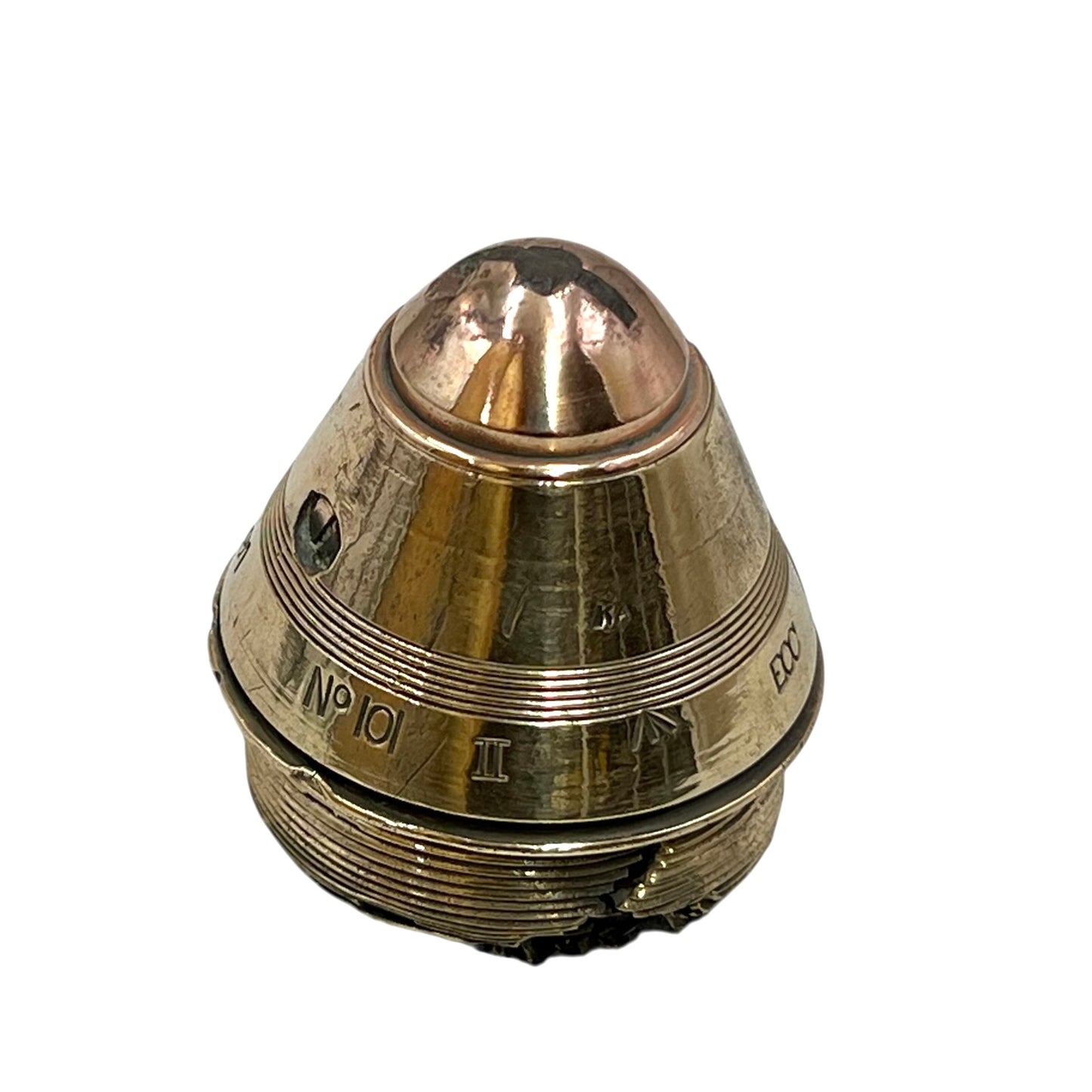 Polished British brass WW1 fuse or paperweight type 101 on a white background