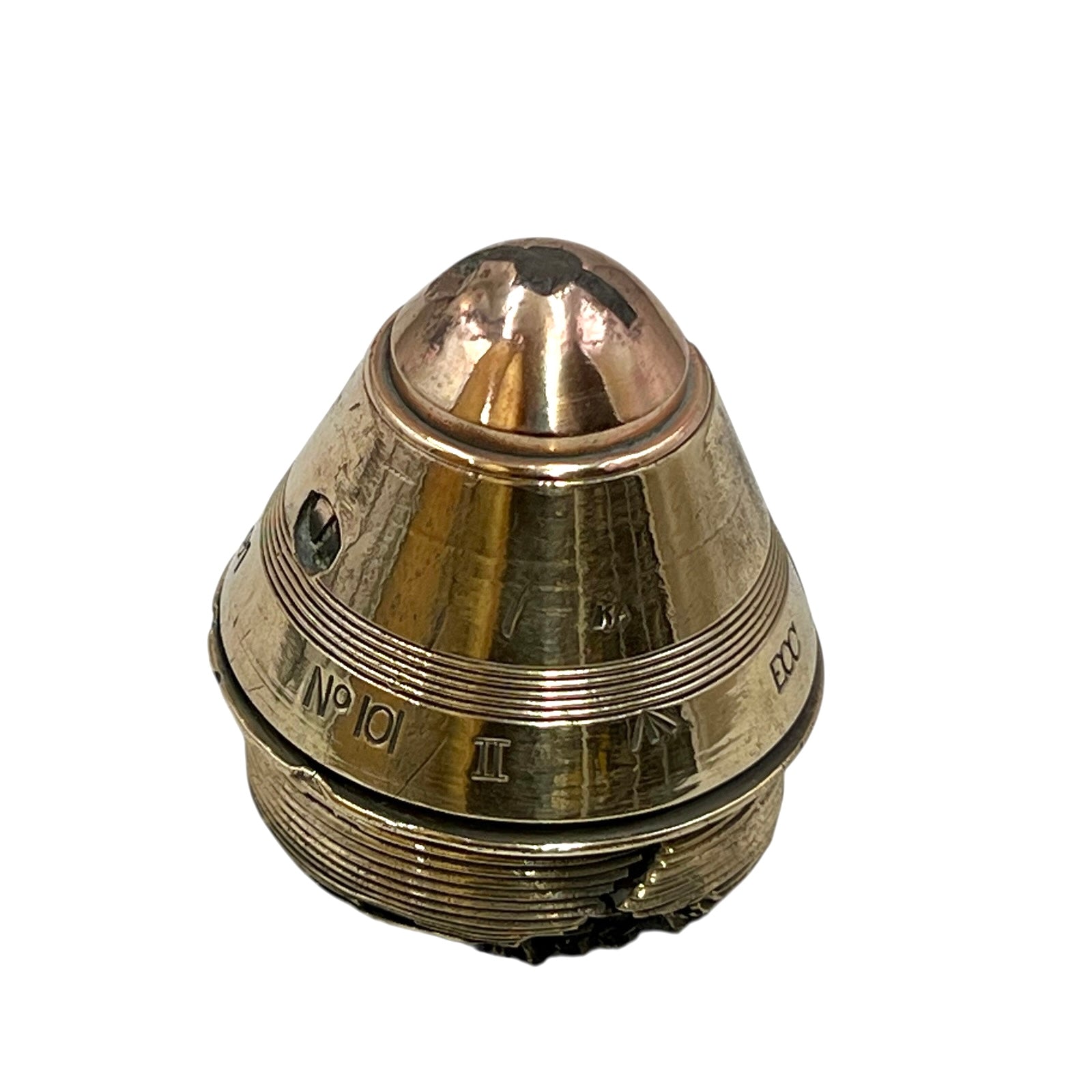 Polished British brass WW1 fuse or paperweight type 101 on a white background