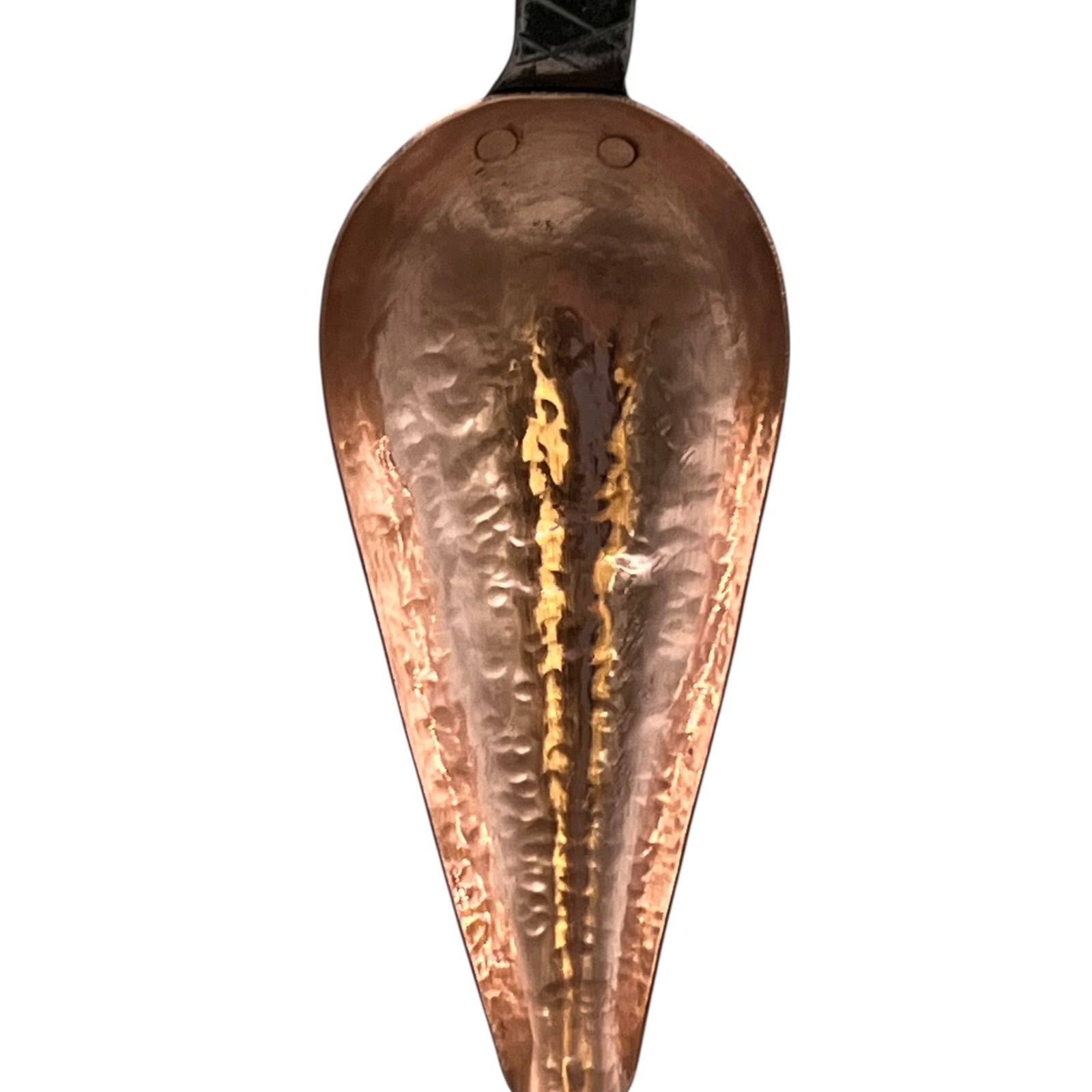 Close up of French copper kitchen utensils with black handles on a white background