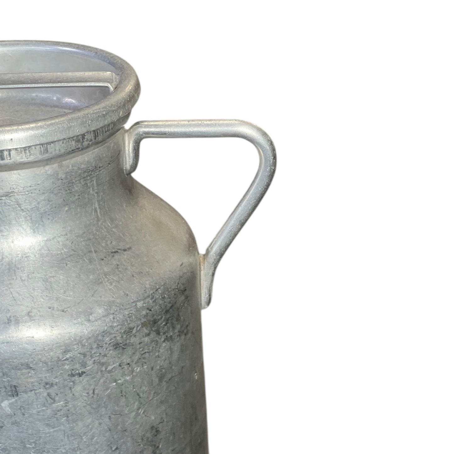 close up of metal milk churn on a white background