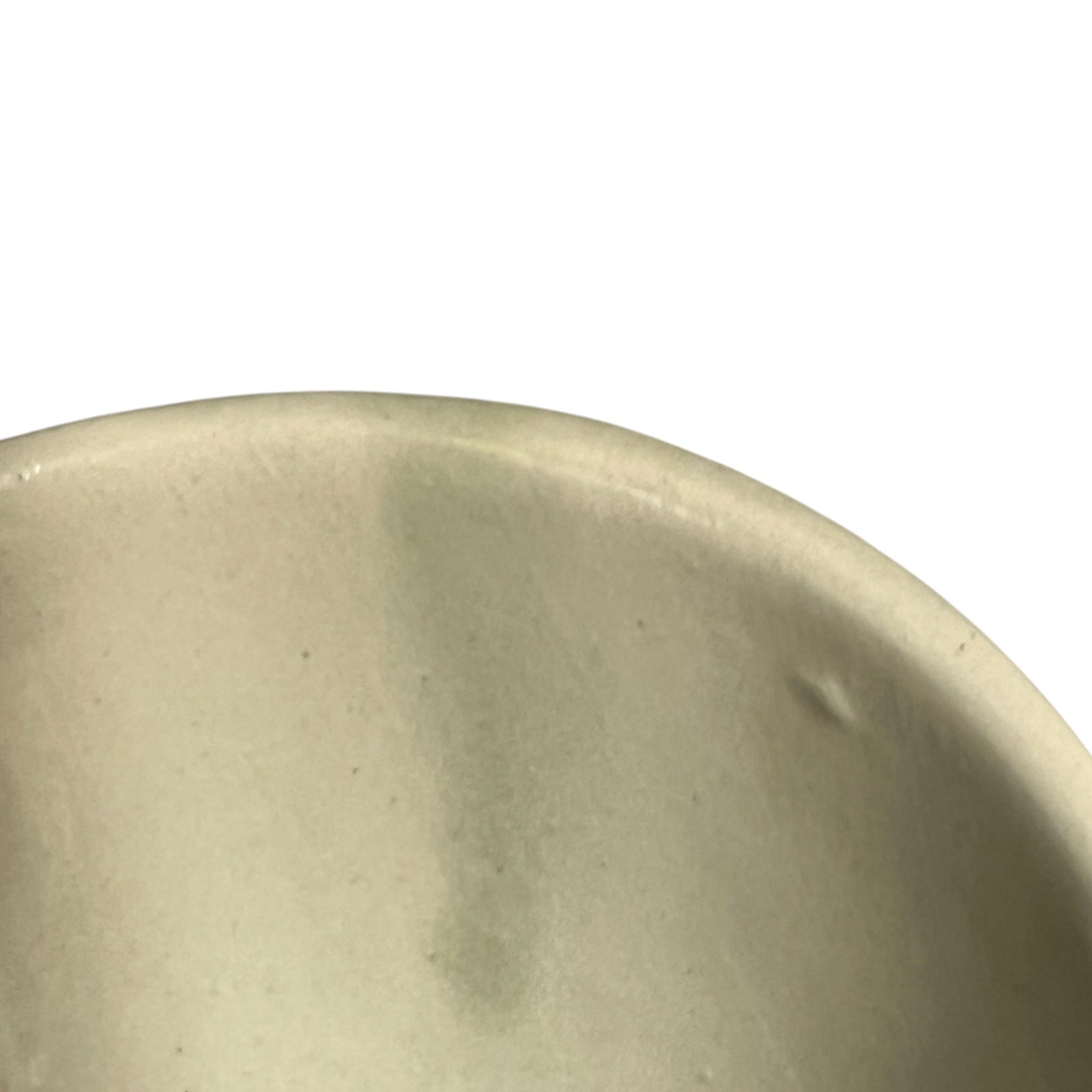 Beige ceramic dish with floral design and 'L'avocat' text on a white background