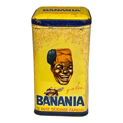 Vintage tin can with 'Banania' branding featuring a smiling face and yellow background.