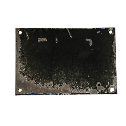 Rectangular metal plate with a worn surface on a white background