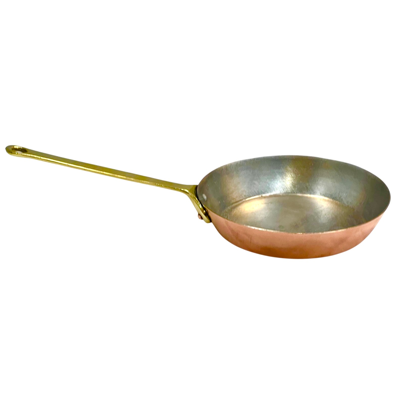 Copper frying pan with a gold handle on a white background