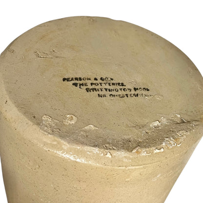 close up of a ww1 SRD jar base with a makers stamp on a white background 