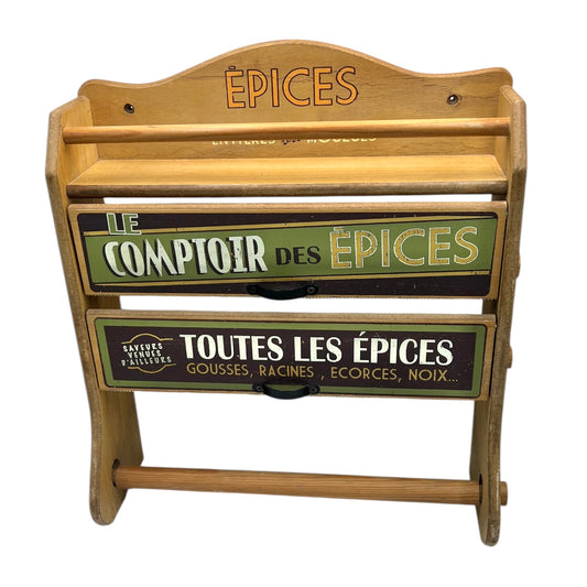Wooden spice rack with engraved text on a white background