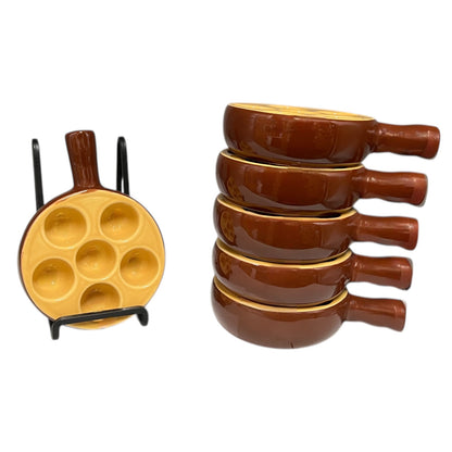 Set of 6 brown ceramic escargots dishes with handles and a pale interior, on a white background.