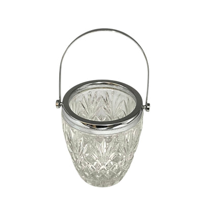 Crystal glass ice bucket with silver rim on a white background