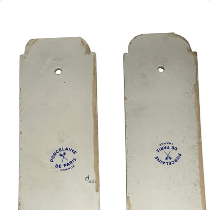 close up of door push plate with a Paris makers stamp on a white background