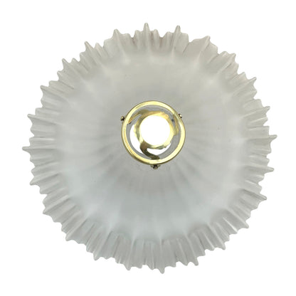 Decorative French vintage frosted glass lamp shade with a ribbed design and gold fixture on a white background