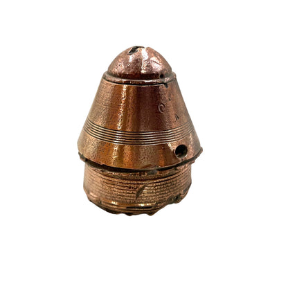 WW1 brass fuse paperweight on a white background