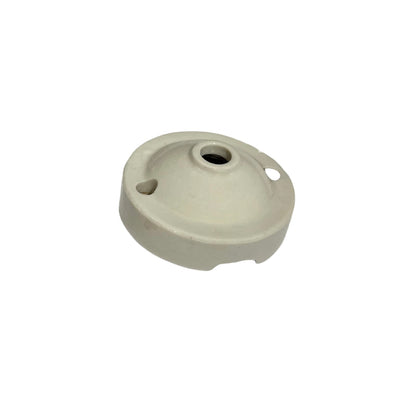 A small off-white ceiling rose with a central hole, a side slot, and a small circular cutout, shown on a plain white background.
