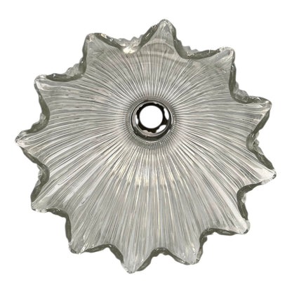 Clear glass lightshade with textured design on a white background