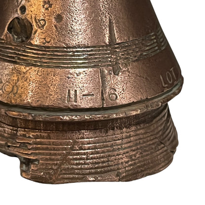 WW1 brass fuse paperweight on a white background 