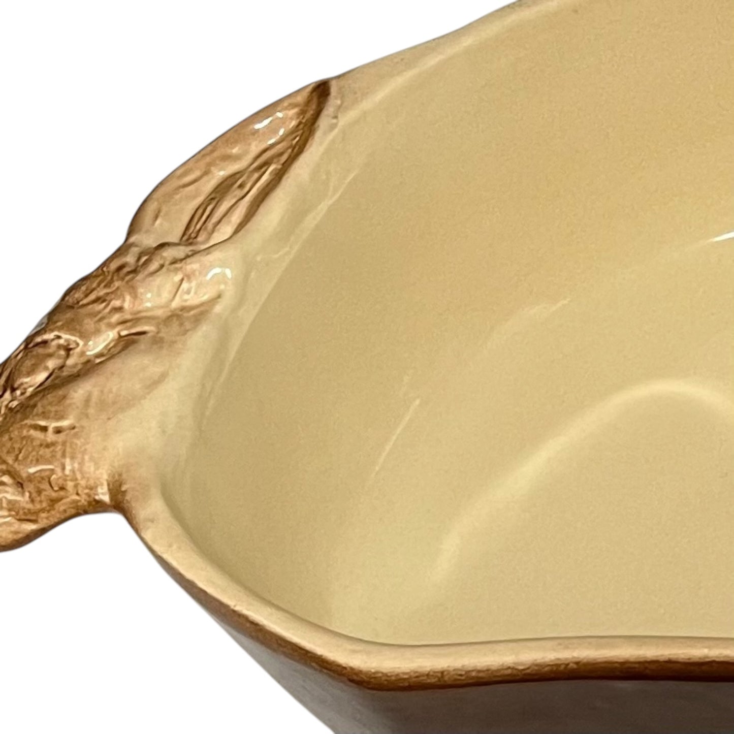 A beige ceramic 2-litre casserole dish shaped like a rabbit, featuring a brown exterior, perfect for serving game dishes or adding charm to a farmhouse-style country kitchen, set against a white background.