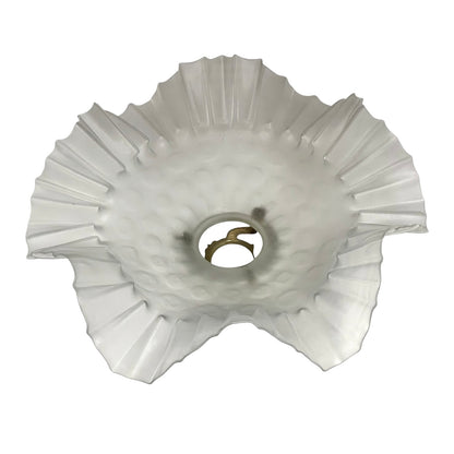 inside view of a French vintage frosted glass lampshade with a frilled scalloped style edge  on a white background