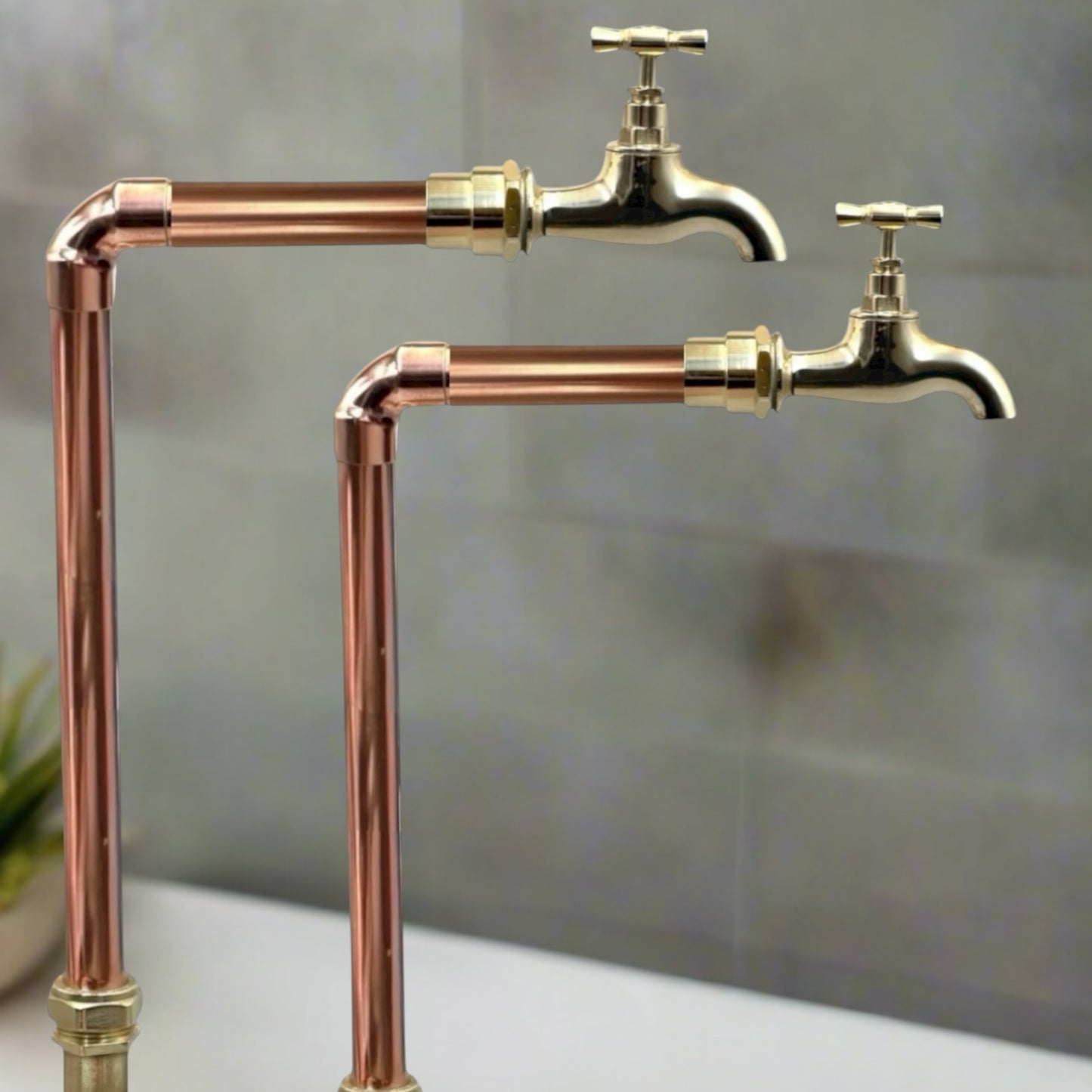 Vintage-style copper and brass faucet taps  on a neutral background