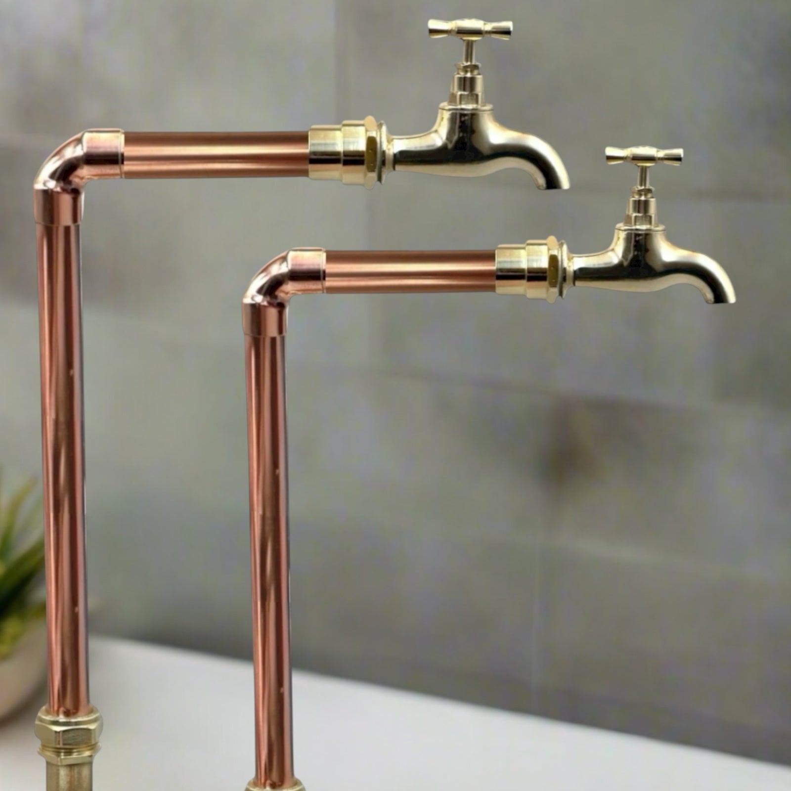 Vintage-style copper and brass faucet taps  on a neutral background