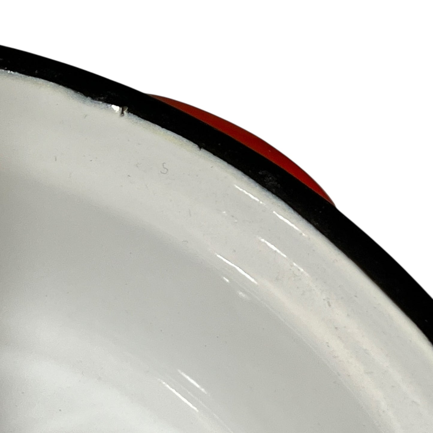 Close-up of a red enamel skillet on a white background