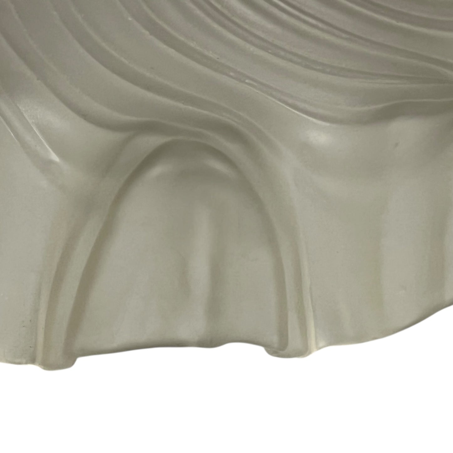 Close up of a vintage-style light fixture with frosted glass shade on a white background