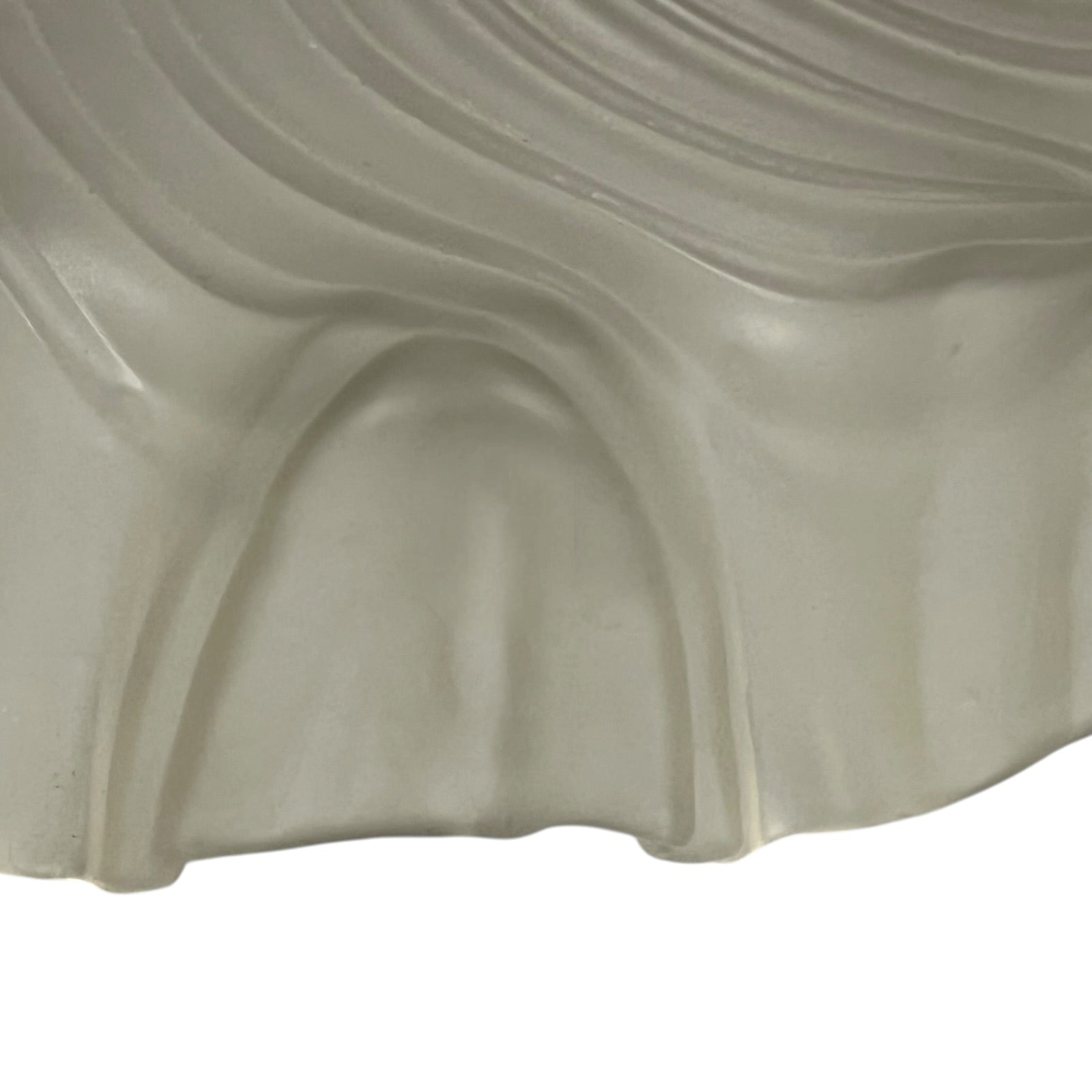 Close up of a vintage-style light fixture with frosted glass shade on a white background