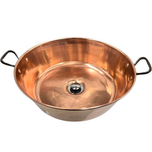 Copper sink with handles on a white background