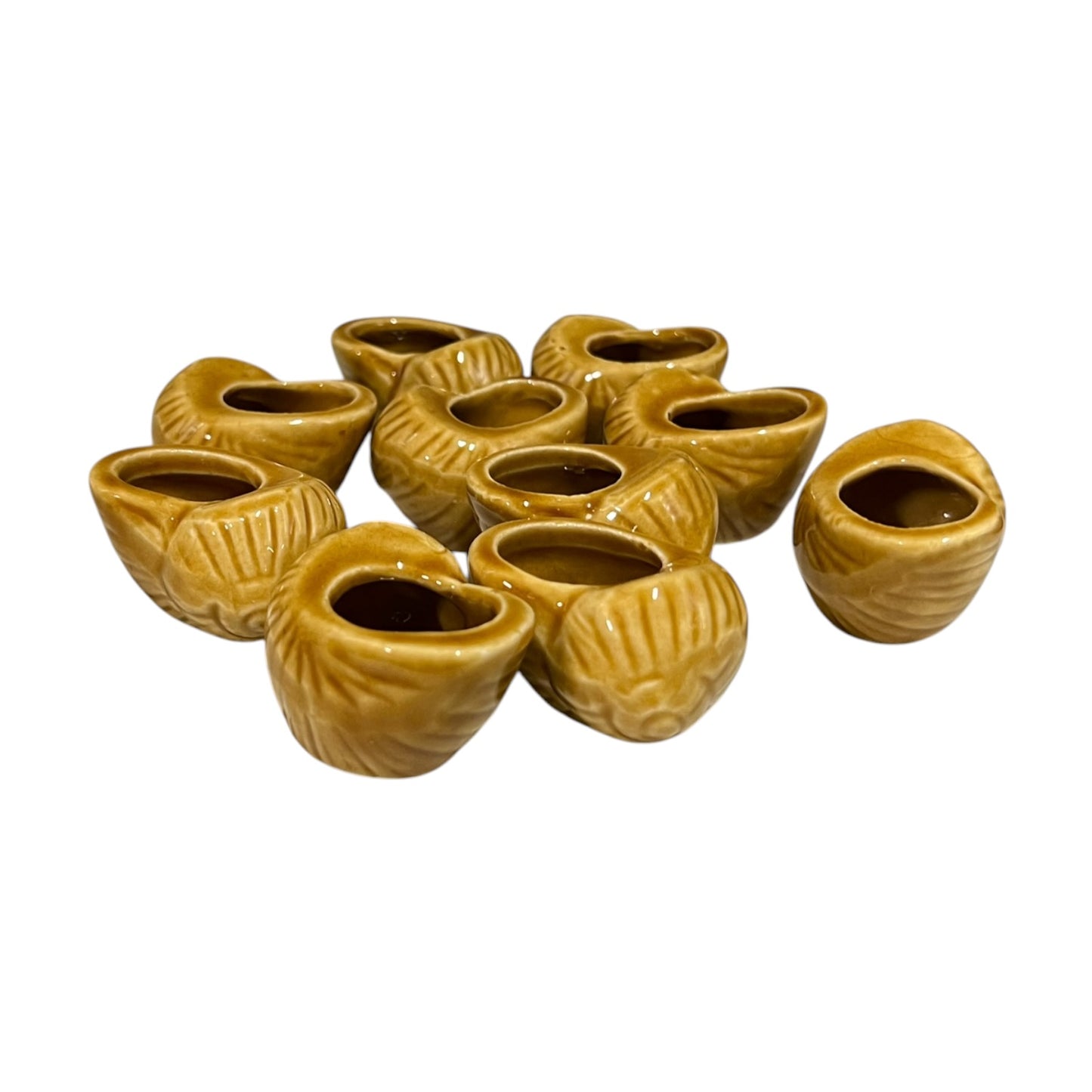 Set of ten small brown ceramic escargots snail pots on a white background