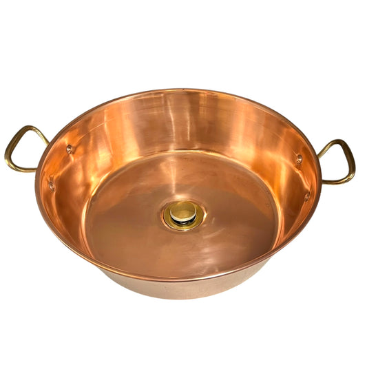 Copper up cycled basin sink with handles and a brass pop up waste on a white background