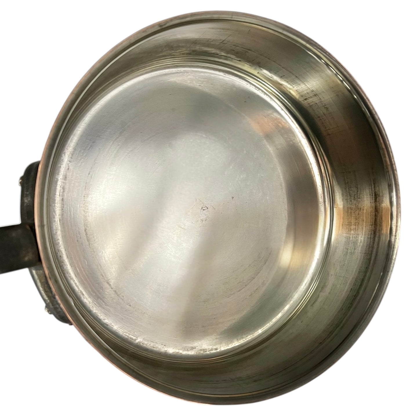 inside of copper pan with tin lining on a white background