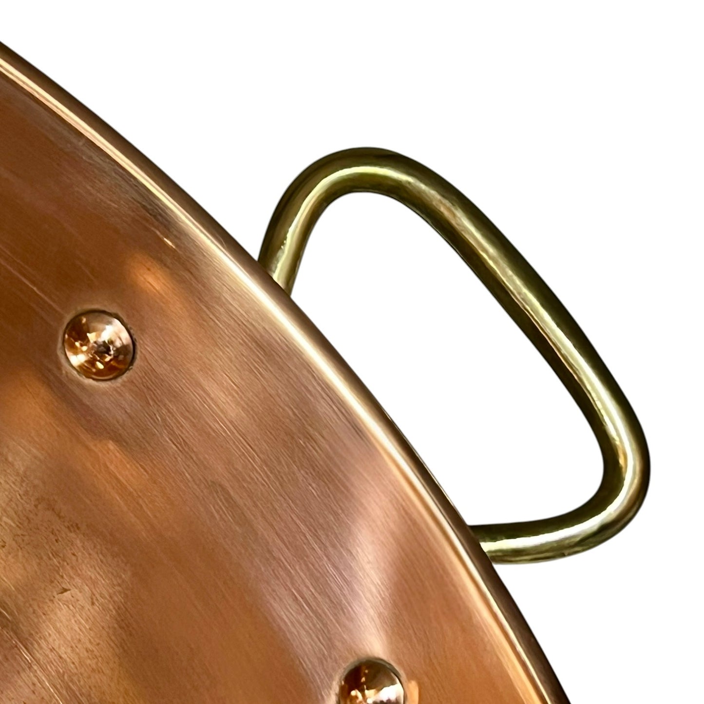Close-up of a copper sink with a drain plug