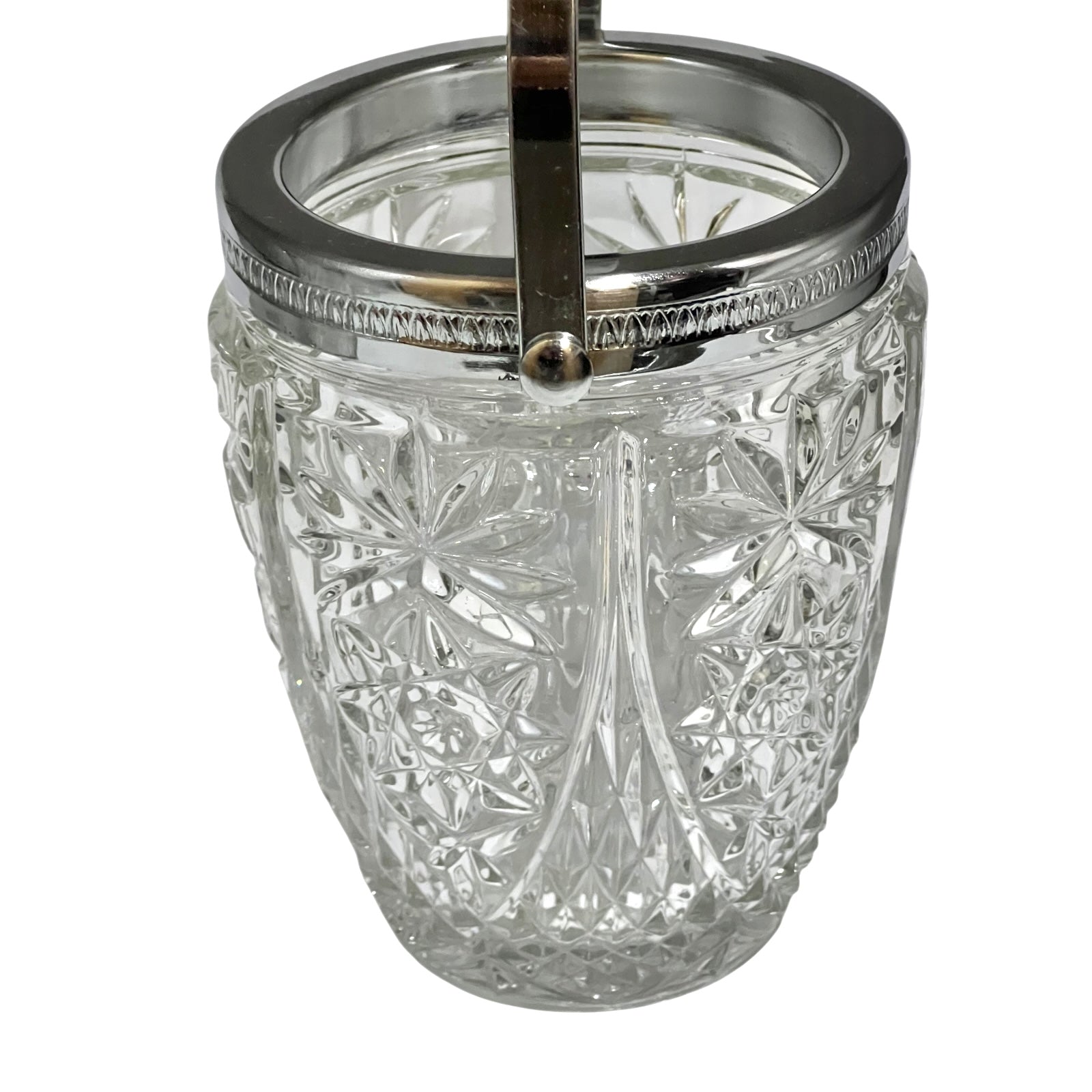 Decorative glass vintage ice bucket with metal collar and handle on a white background