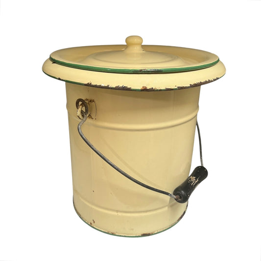 A charming French vintage enamel lidded potty bucket with a wooden handle, featuring a cream finish accented by a green trim. Perfect for use in a farmhouse kitchen as a vegetable or bread bin, or repurposed as a unique garden planter, displayed against a crisp white background.
