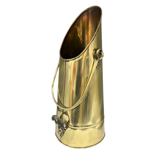 Brass coal scuttle with handle on a white background