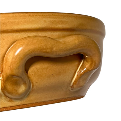 Close-up of a decorative bowl with a wavy design on a white background