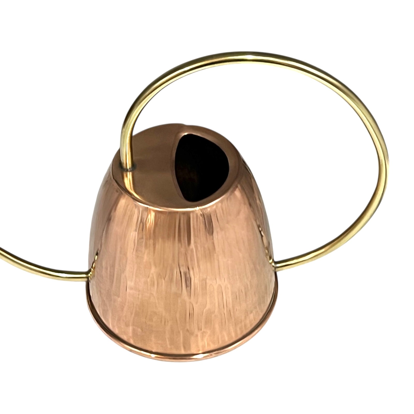 Copper and brass watering can on a white background