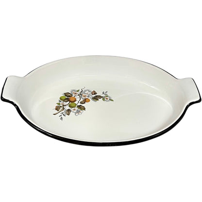 White enamel dish with floral design on a white background